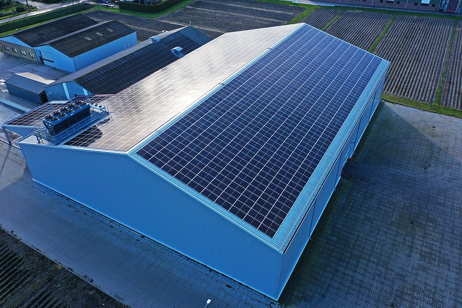 Roof of a commercial building full of solar panels. The new green energy supplier