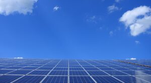 clounds hover above solar panels in tucson, az