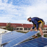 solar panel installers on a roof in marana, az